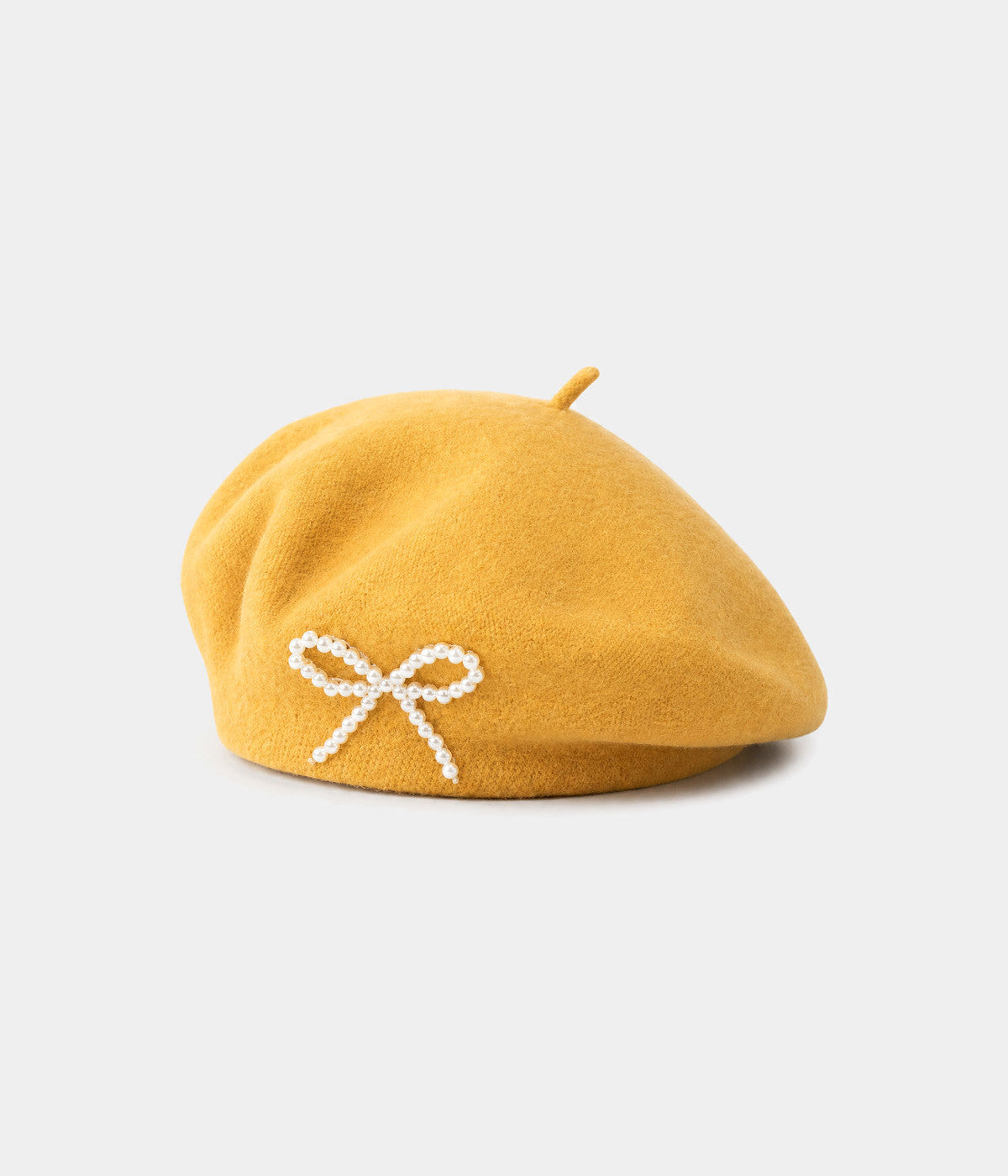 PEARL BOW BERET. wool beret in YELLOW, front view