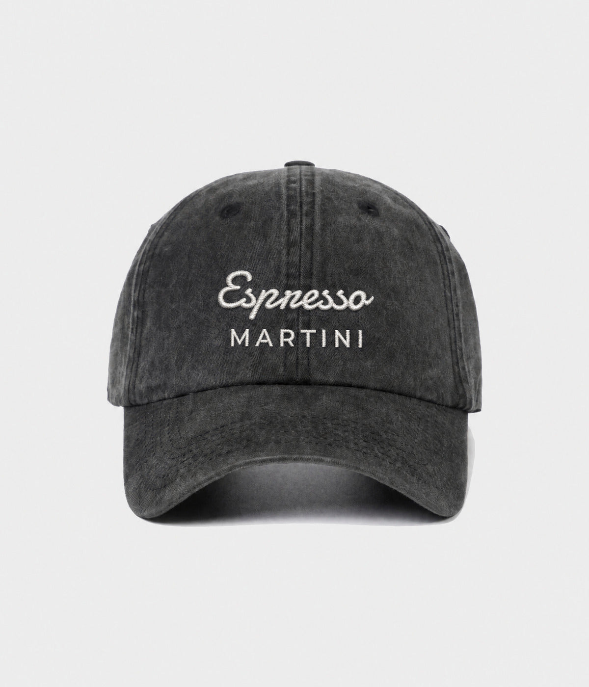 ESPRESSO MARTINI. washed black cotton dad cap with embroidered Espresso Martini wordmark, front view
