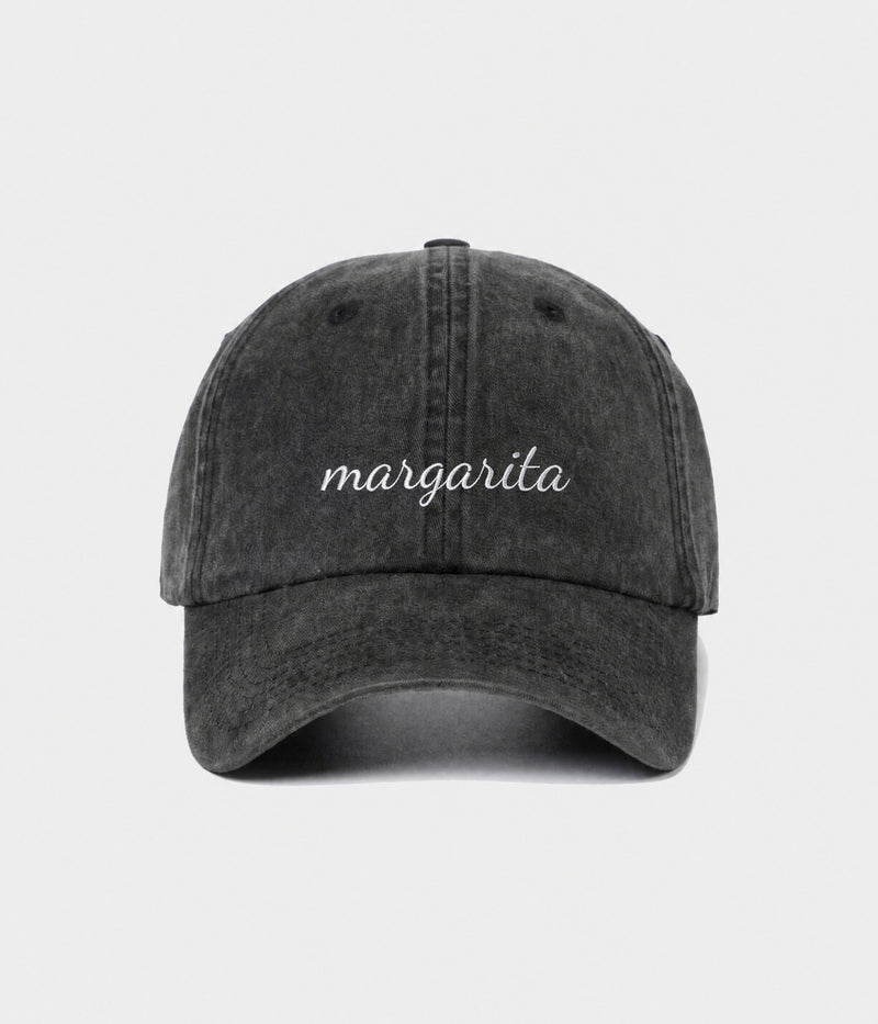 MARGARITA - CURSIVE. washed black cotton dad cap with embroidered margarita script, front view