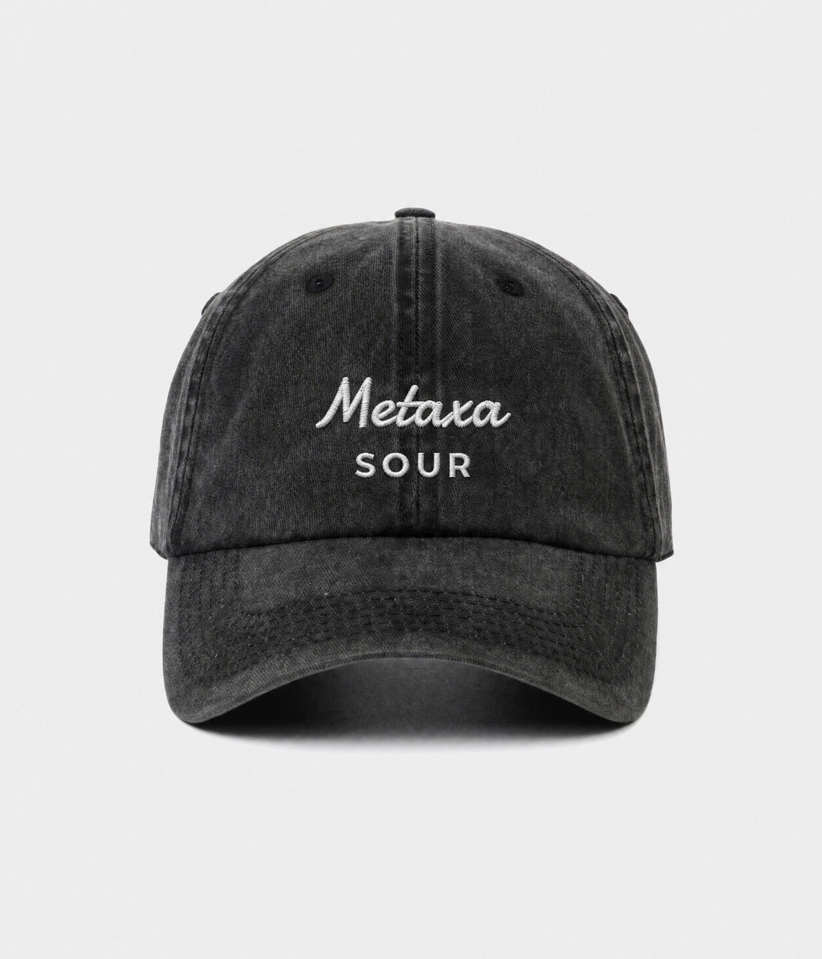 METAXA SOUR. washed black cotton dad cap with embroidered Metaxa Sour wordmark, front view