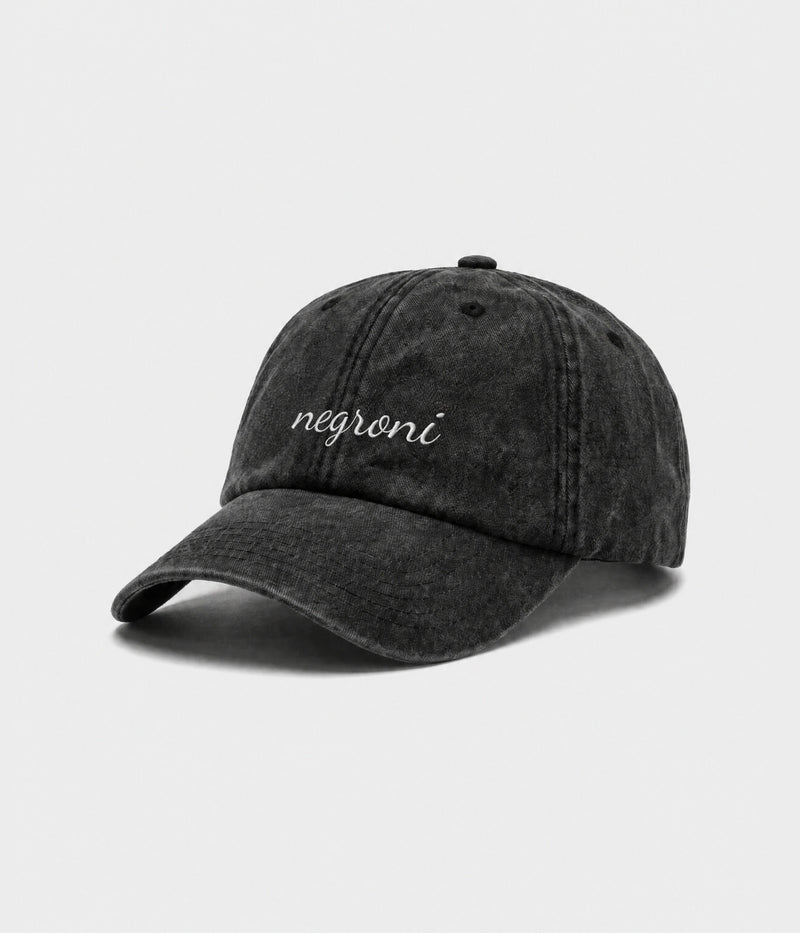 NEGRONI - CURSIVE. washed black cotton dad cap with embroidered negroni script, side view