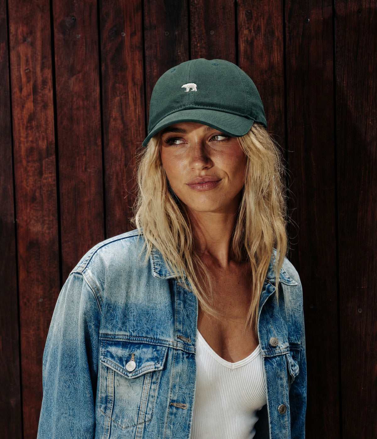 BEAR. DARK GREEN worn by a woman