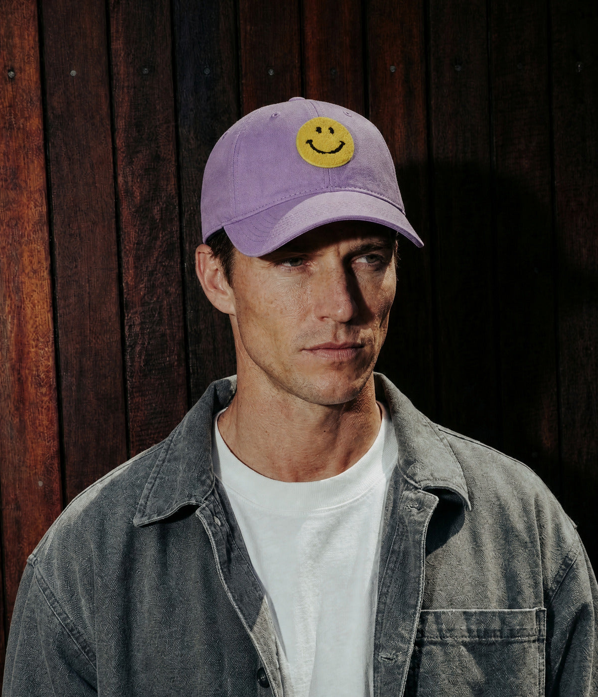 BIG SMILE. PURPLE worn by a man