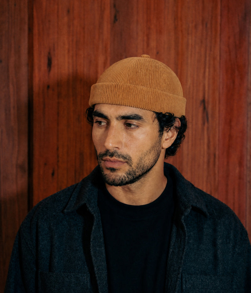 CORDUROY FISHERMAN BEANIE. — BROWN worn