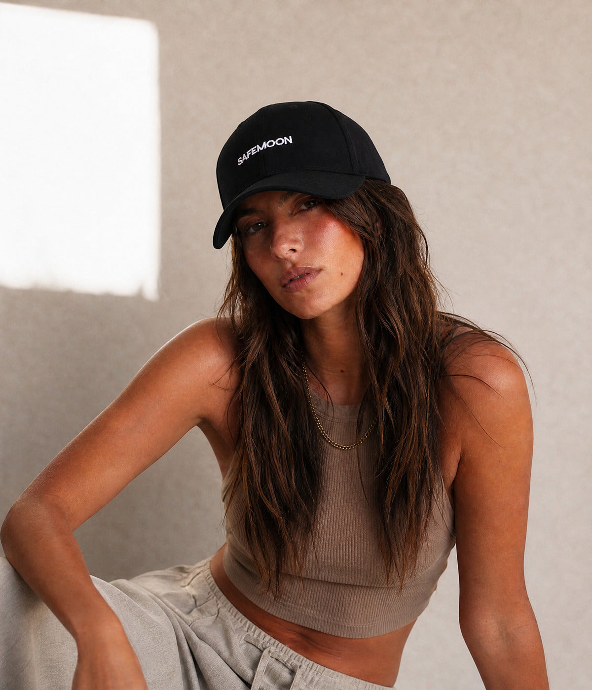 CRYPTO CAP. - SAFEMOON worn by a woman