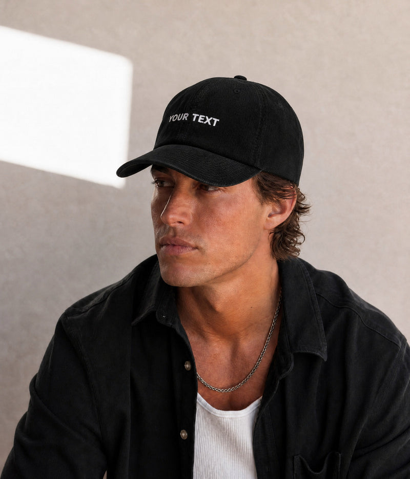 CUSTOM CORDUROY CAP. BLACK worn by a man