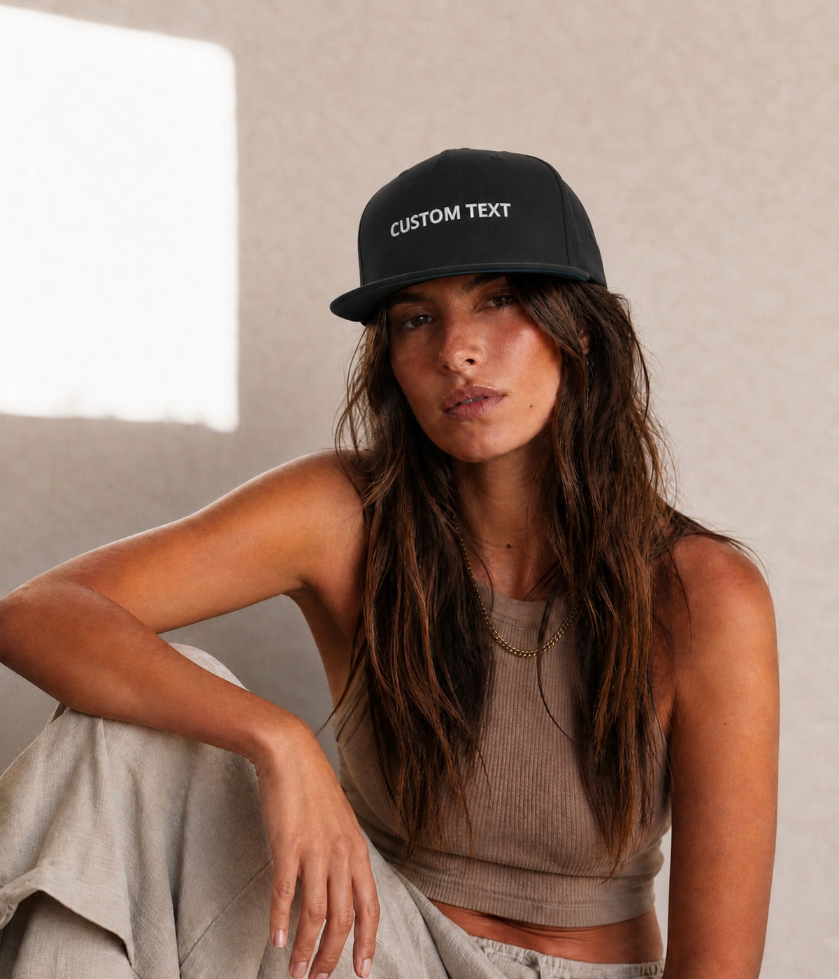 CUSTOM FLAT BILL CAP. BLACK worn by a woman