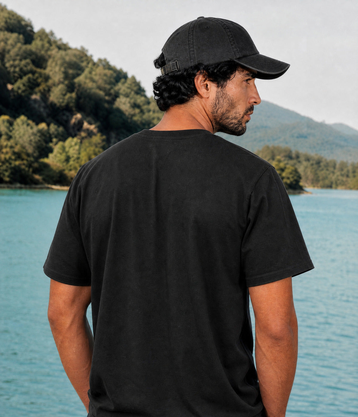 CUSTOM TEE. BLACK worn by a man, back view