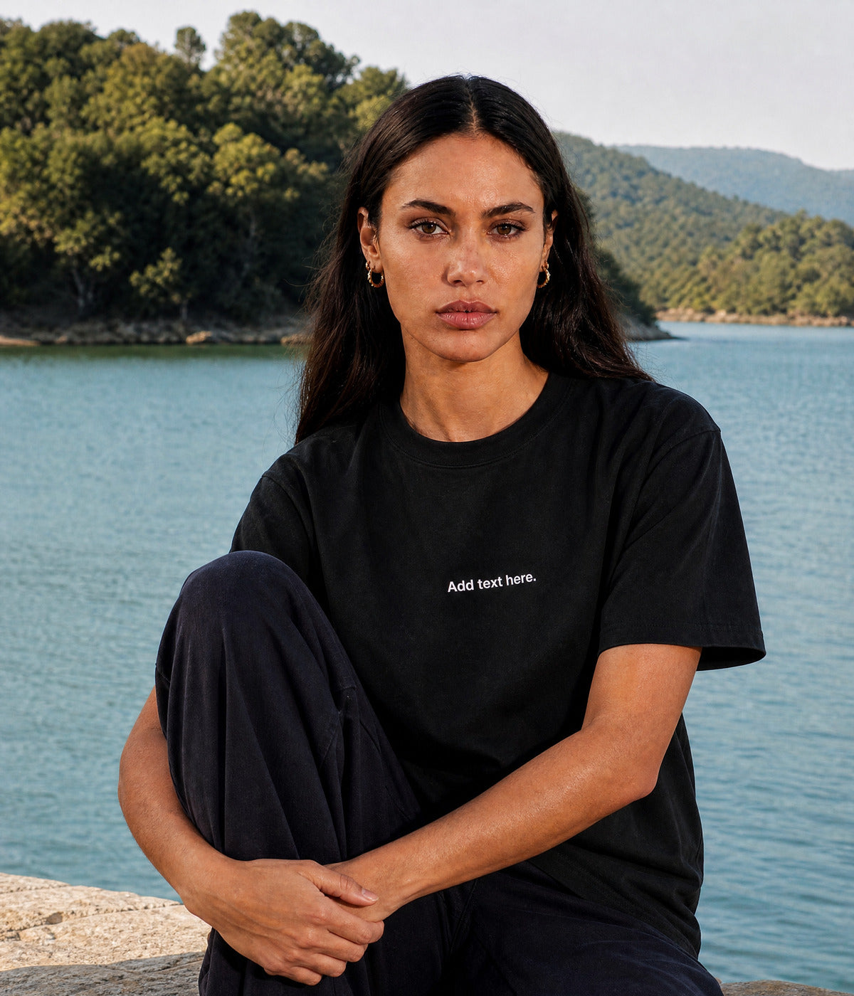 CUSTOM TEE. BLACK worn by a woman