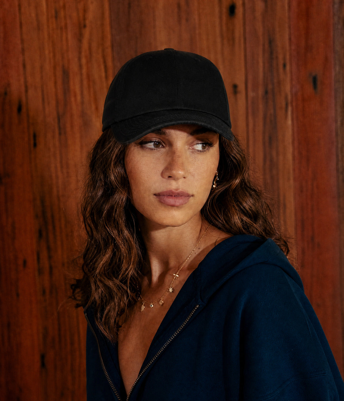 PREMIUM DAD CAP. BLACK worn by a woman