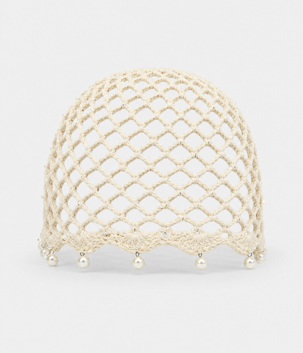 PEARL CROCHET CAP. open-mesh crochet cloche with pearl trim in beige, front view