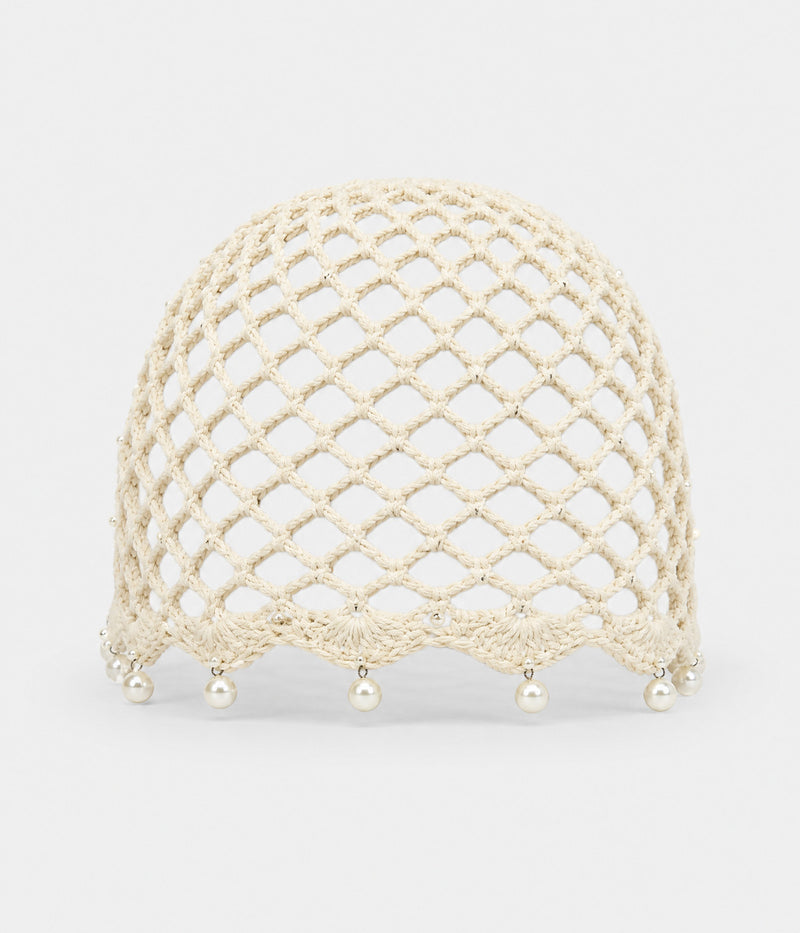 PEARL CROCHET CAP. open-mesh crochet cloche with pearl trim in beige, front view