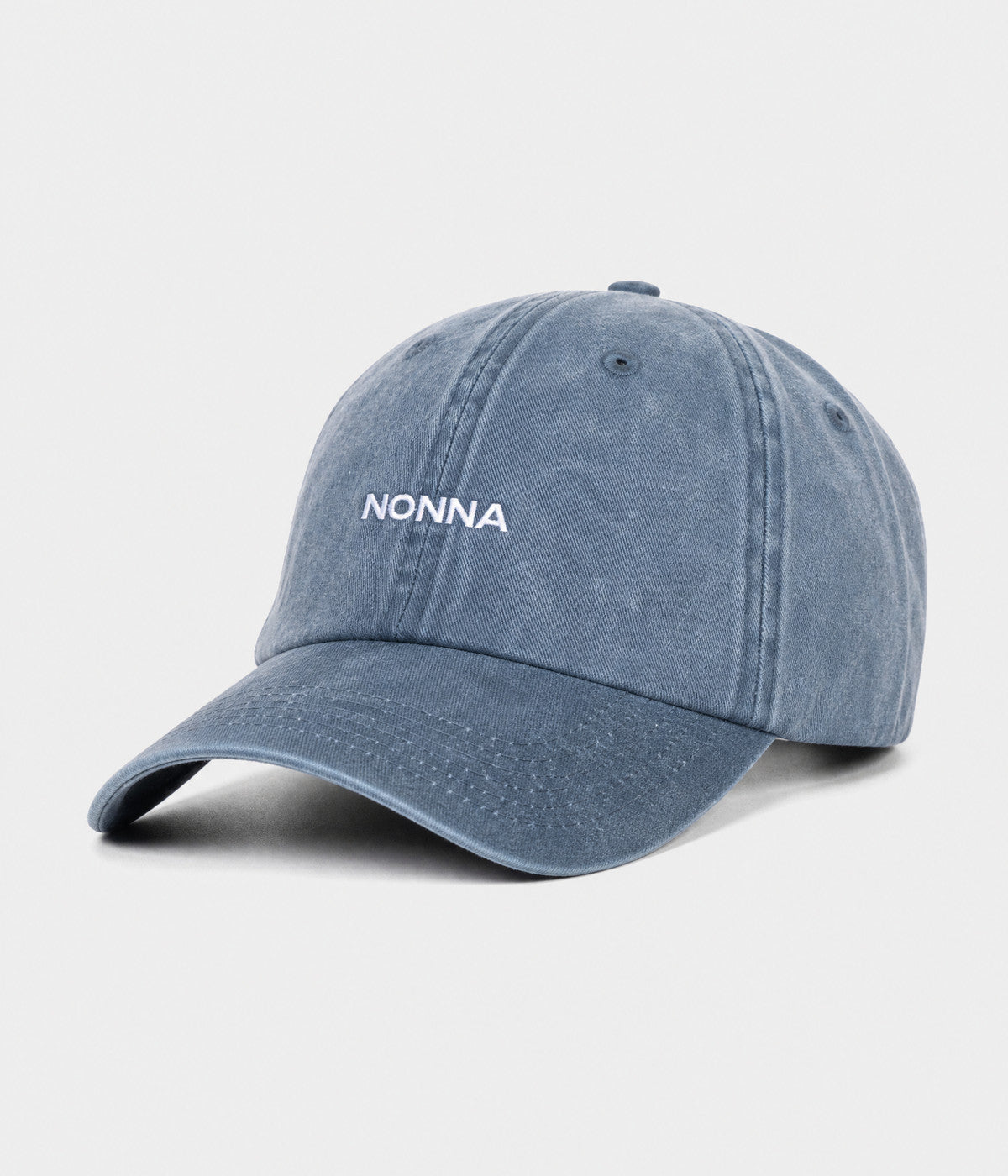 WASHED NONNA. washed cotton dad cap in NAVY, side view