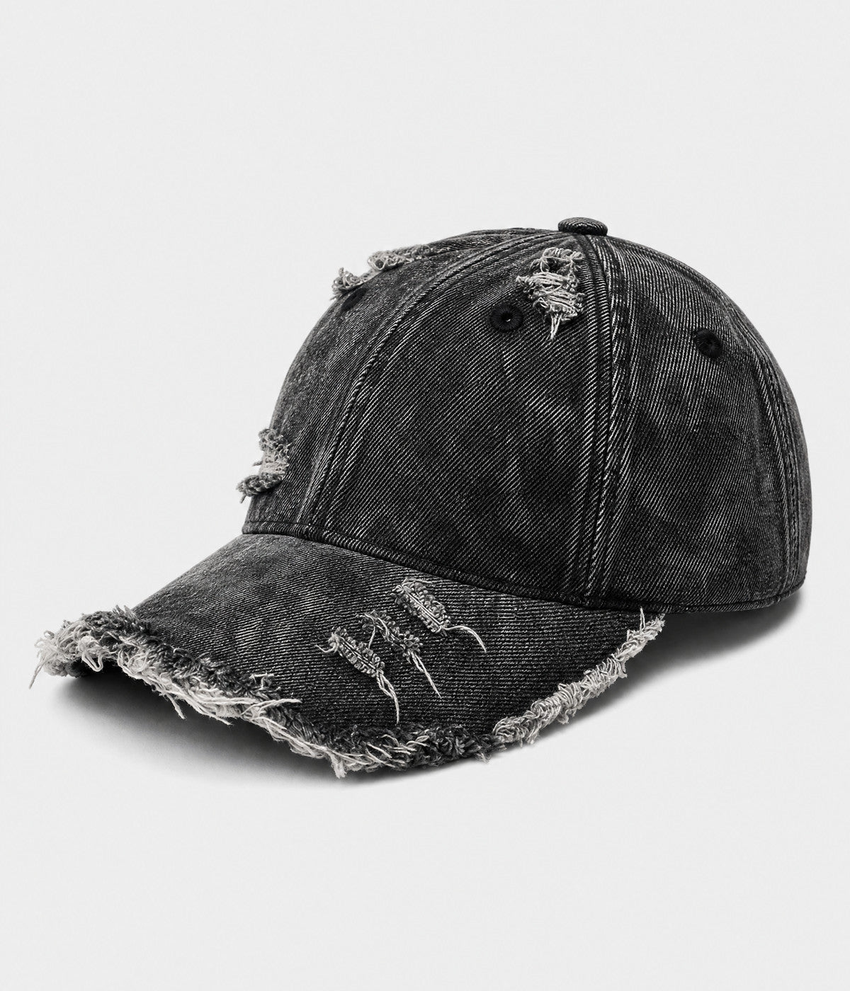 SHREDDED DENIM. acid-wash cotton denim cap in black, side view
