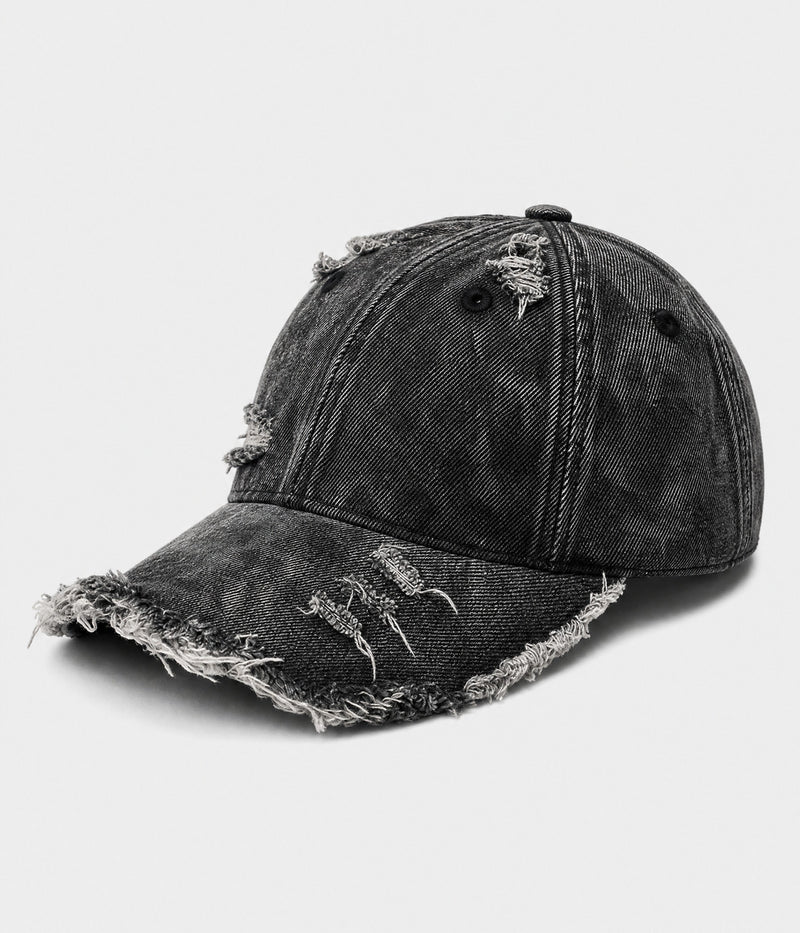SHREDDED DENIM. acid-wash cotton denim cap in black, side view