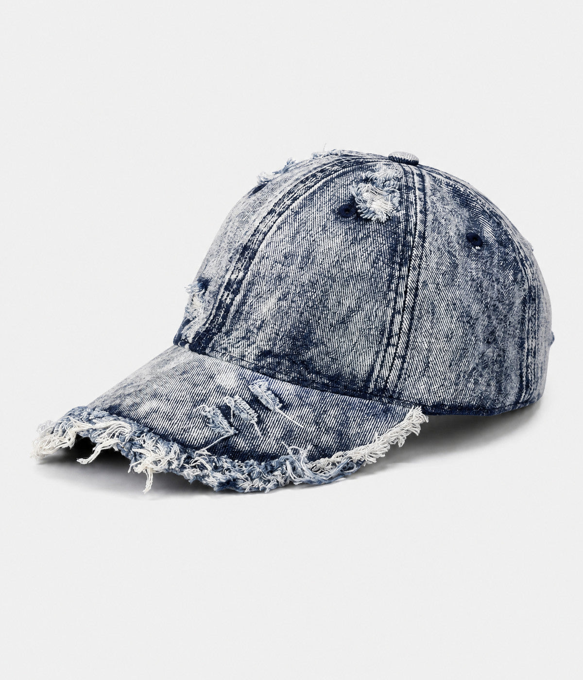 SHREDDED DENIM. acid-wash cotton denim cap in blue, side view