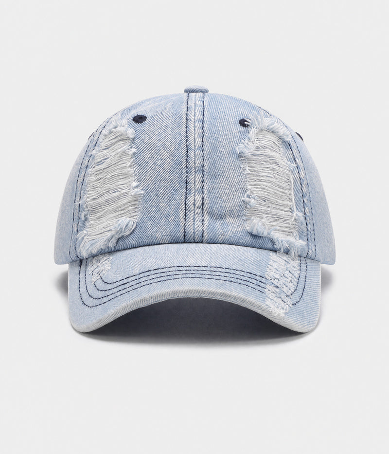 TORN DENIM. washed cotton denim cap in light blue, front view