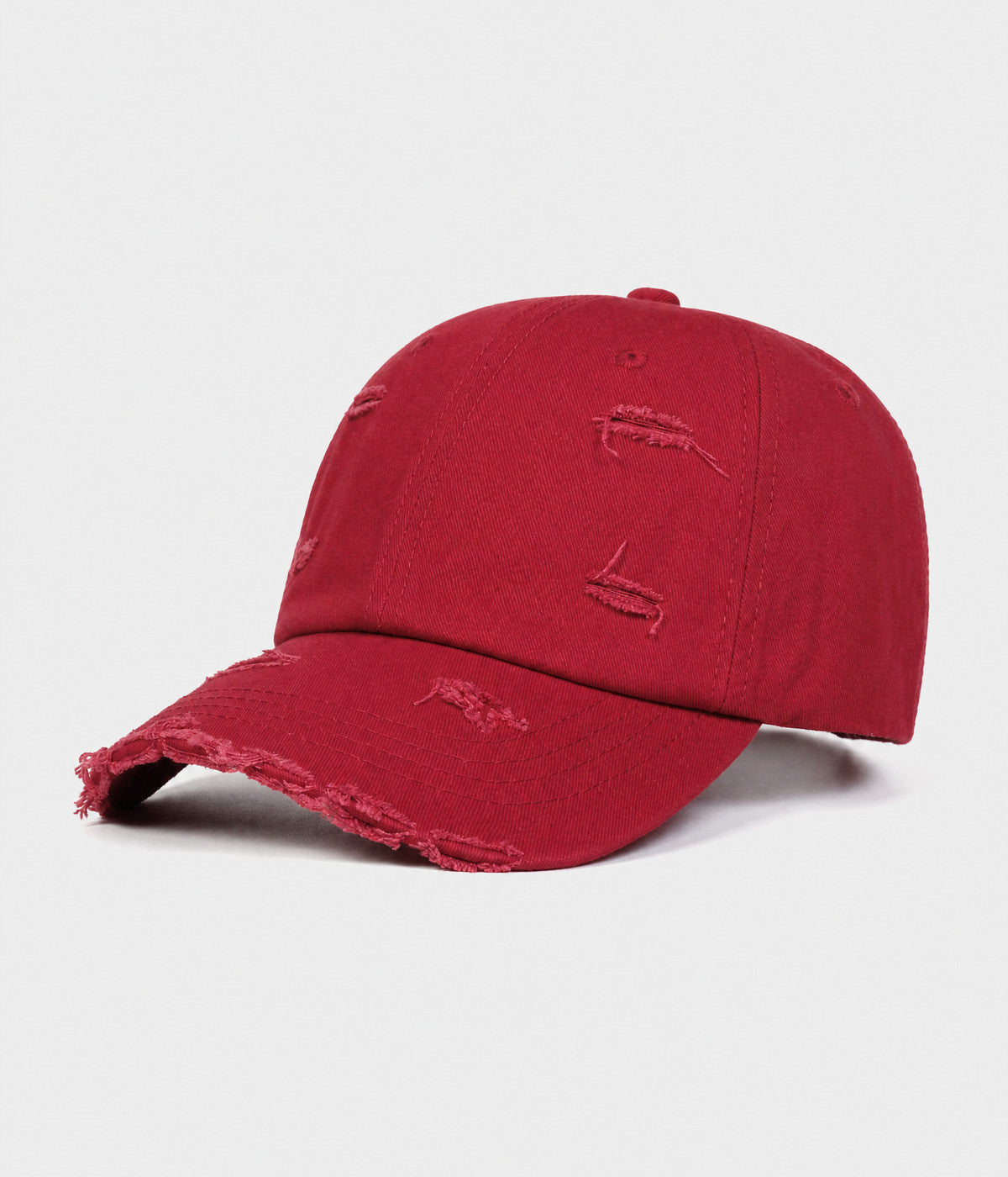 RIPPED COTTON. distressed cotton cap in red, side view