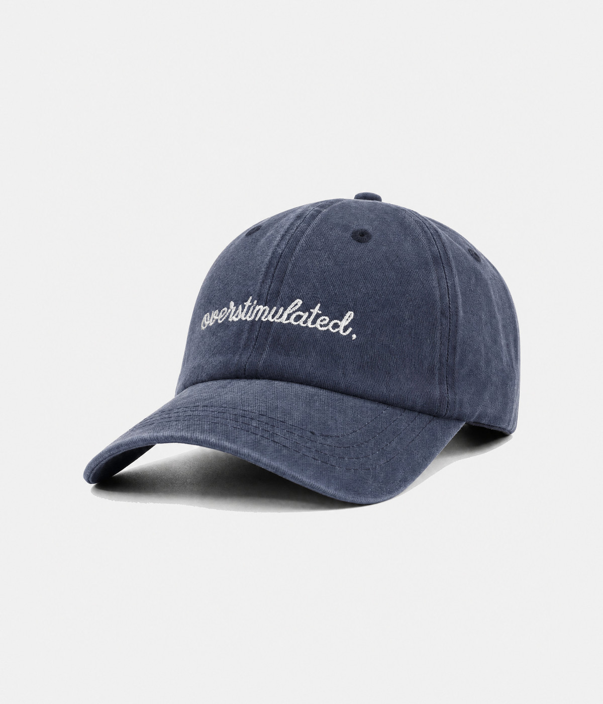 OVERSTIMULATED. washed cotton dad cap in navy, side view