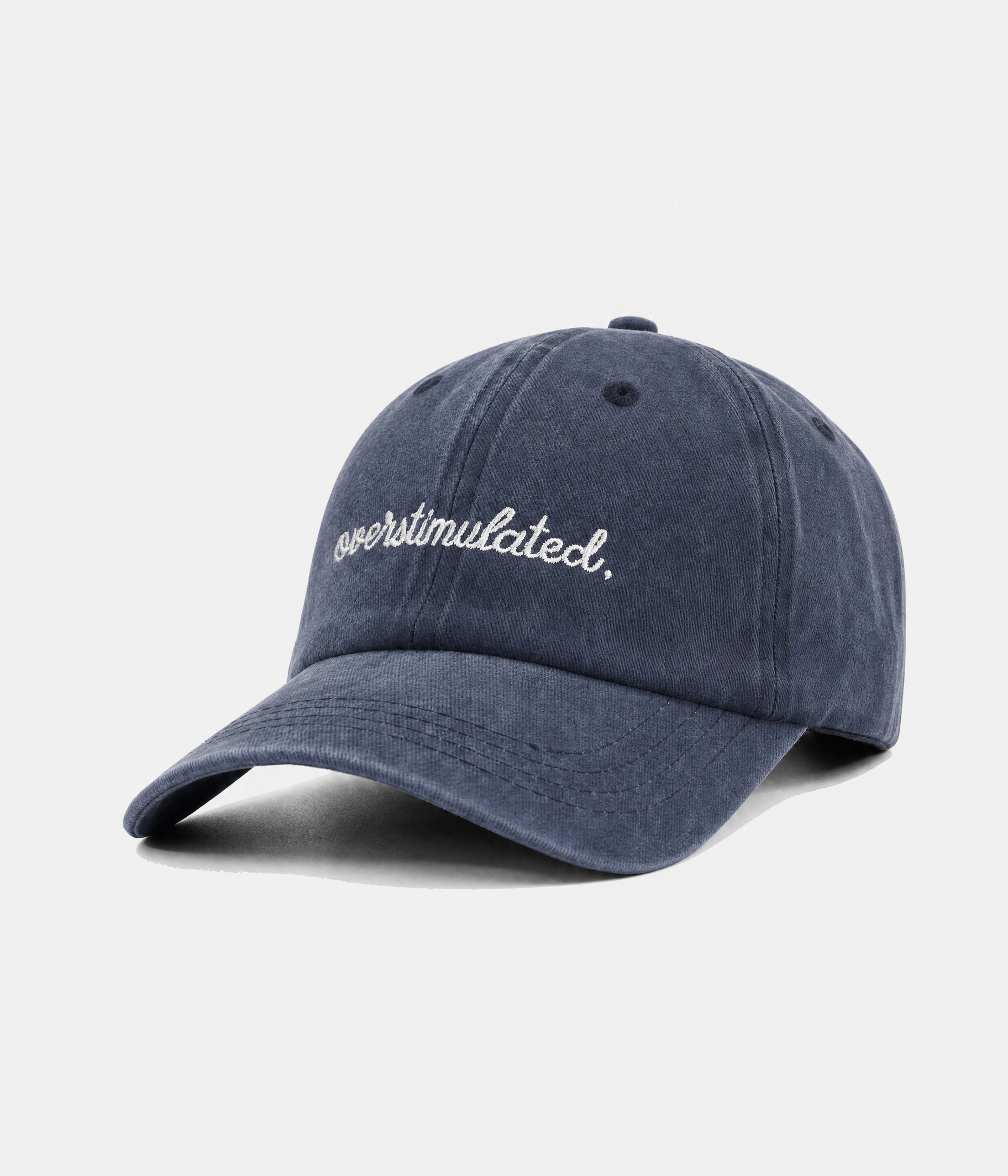 OVERSTIMULATED. washed cotton dad cap in navy, side view