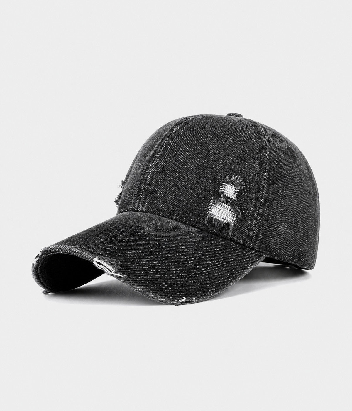 RIPPED DENIM. washed cotton denim cap in black, side view