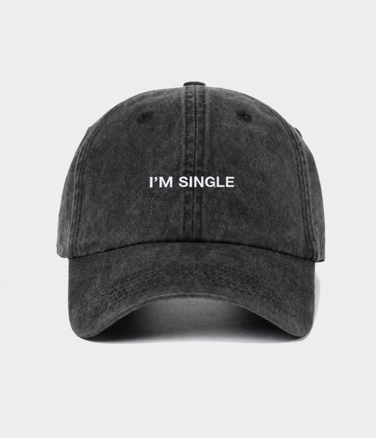 WASHED I'M SINGLE. washed cotton dad cap in BLACK, front view