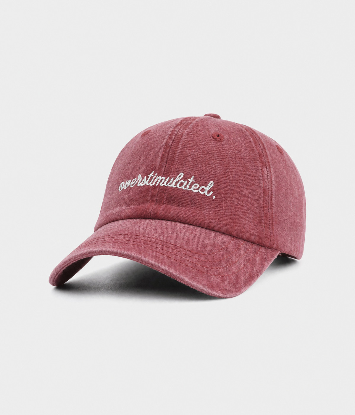 OVERSTIMULATED. washed cotton dad cap in red, side view