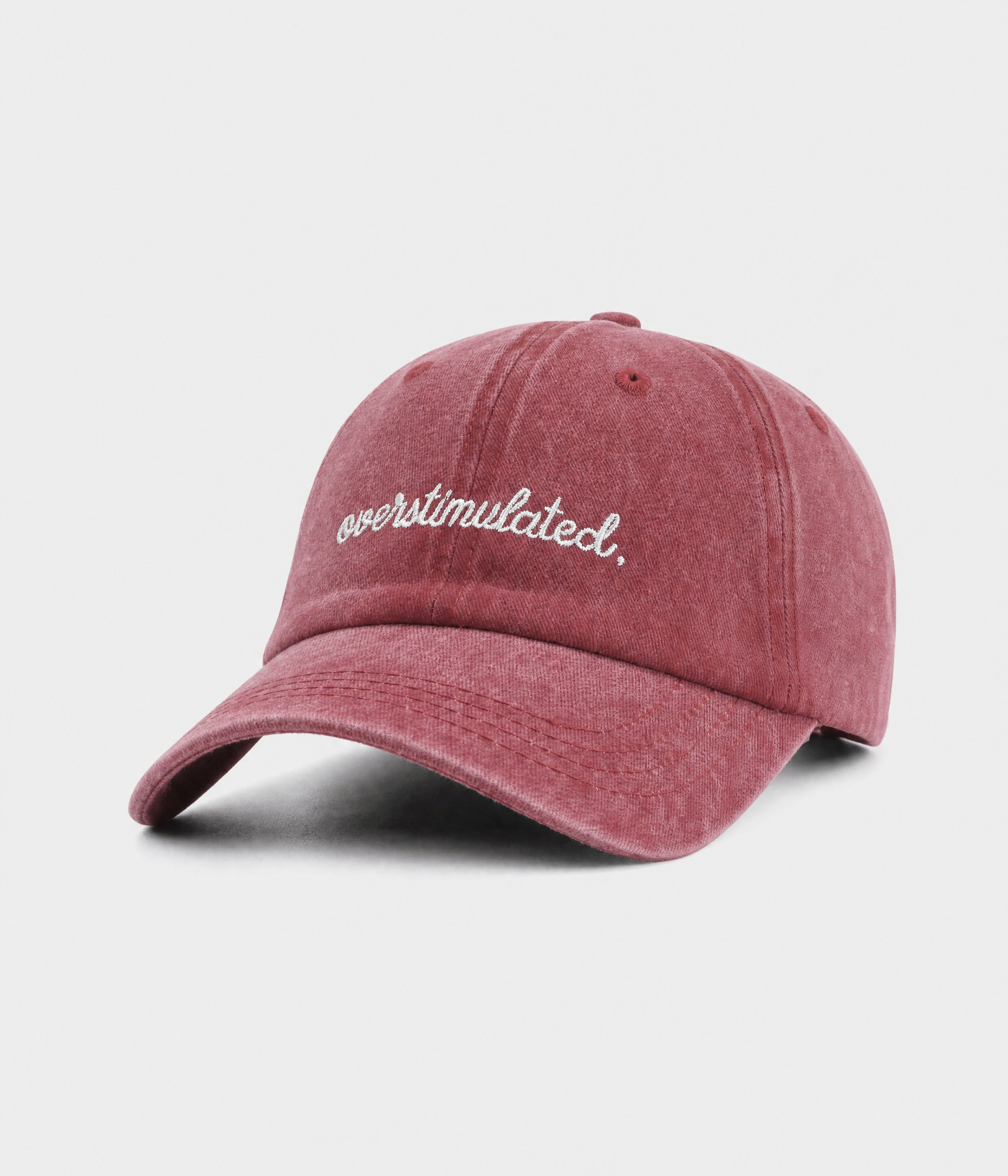 OVERSTIMULATED. washed cotton dad cap in red, side view
