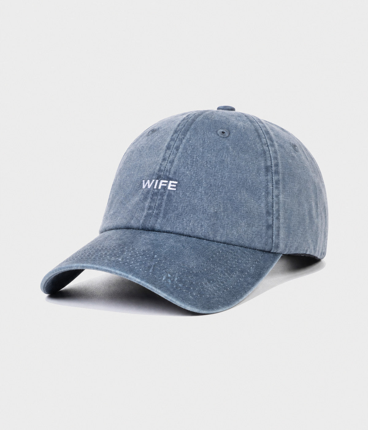 WASHED WIFE. washed cotton dad cap in NAVY, side view