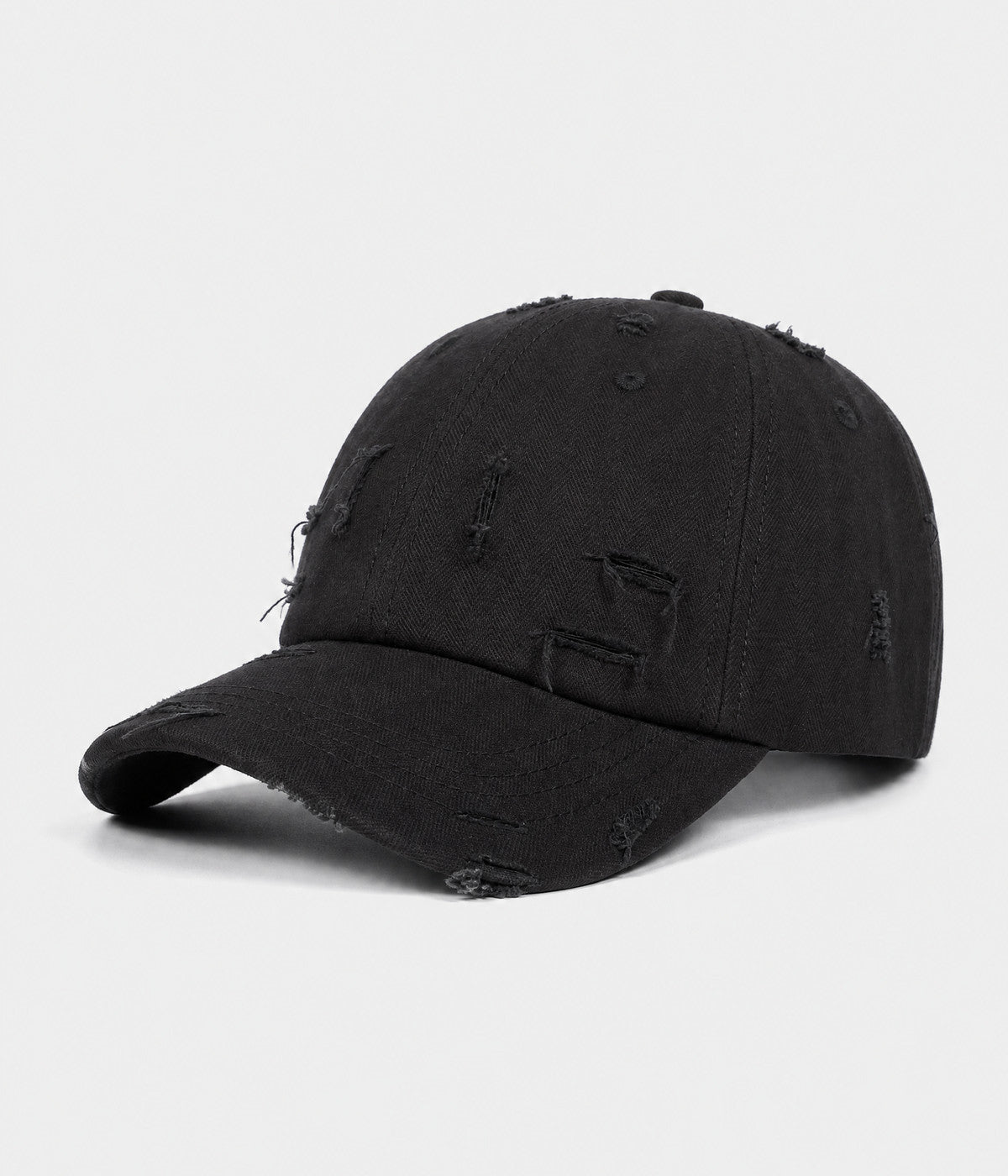 RIPPED COTTON. distressed cotton cap in black, side view