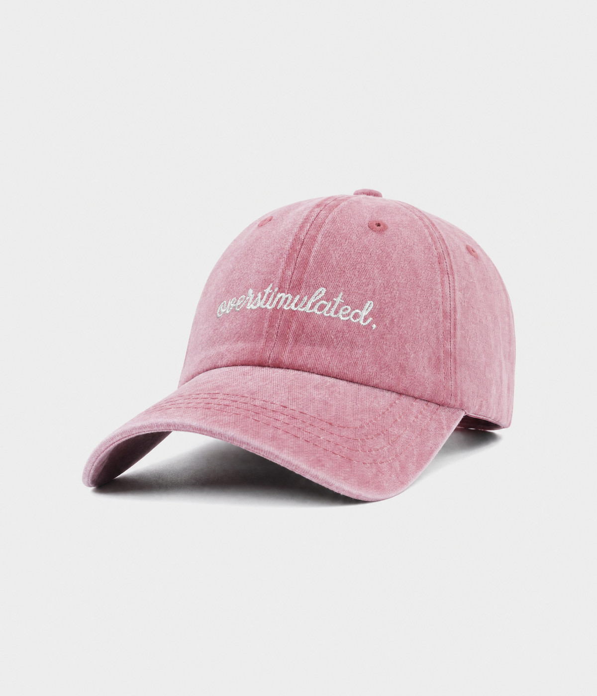 OVERSTIMULATED. washed cotton dad cap in pink, side view