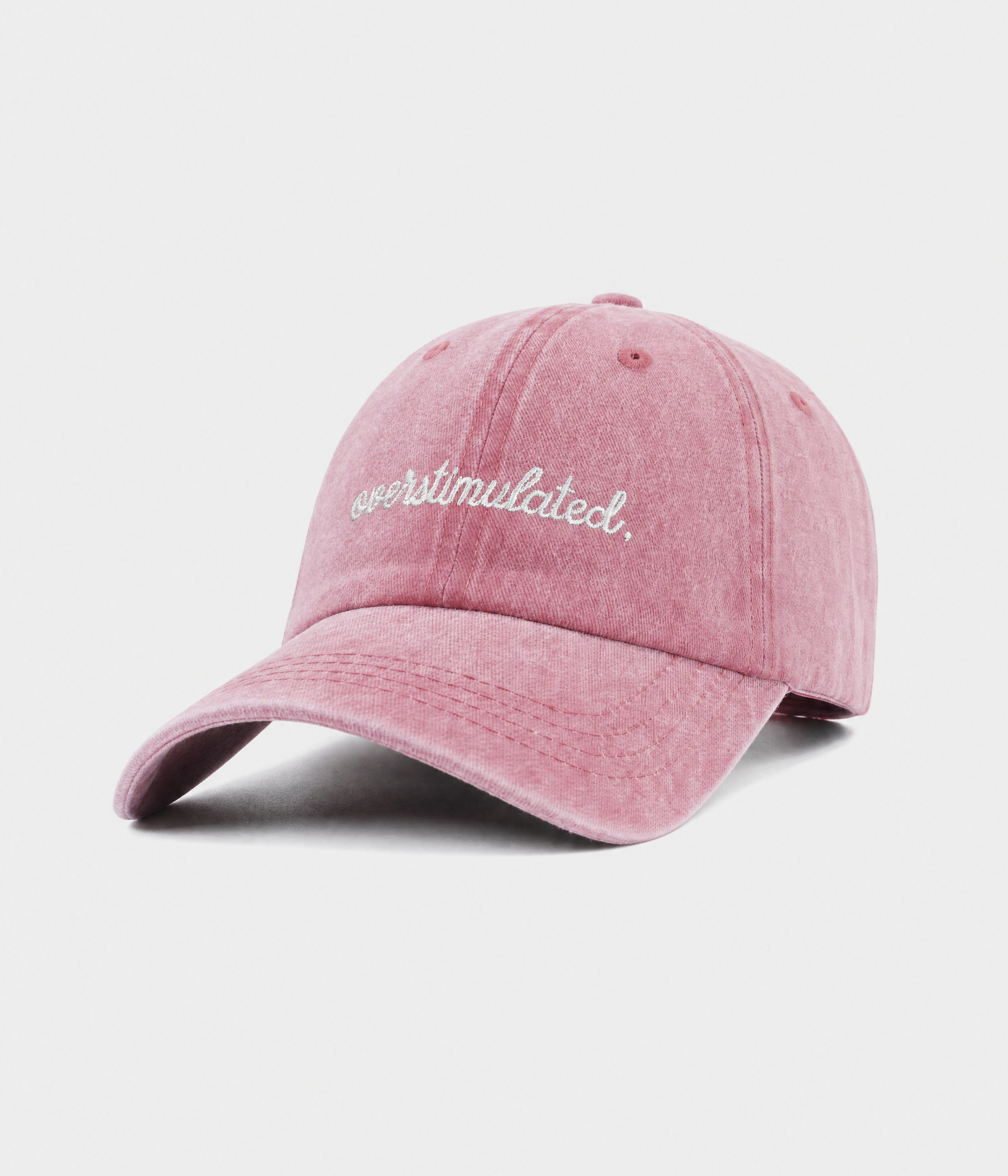 OVERSTIMULATED. washed cotton dad cap in pink, side view