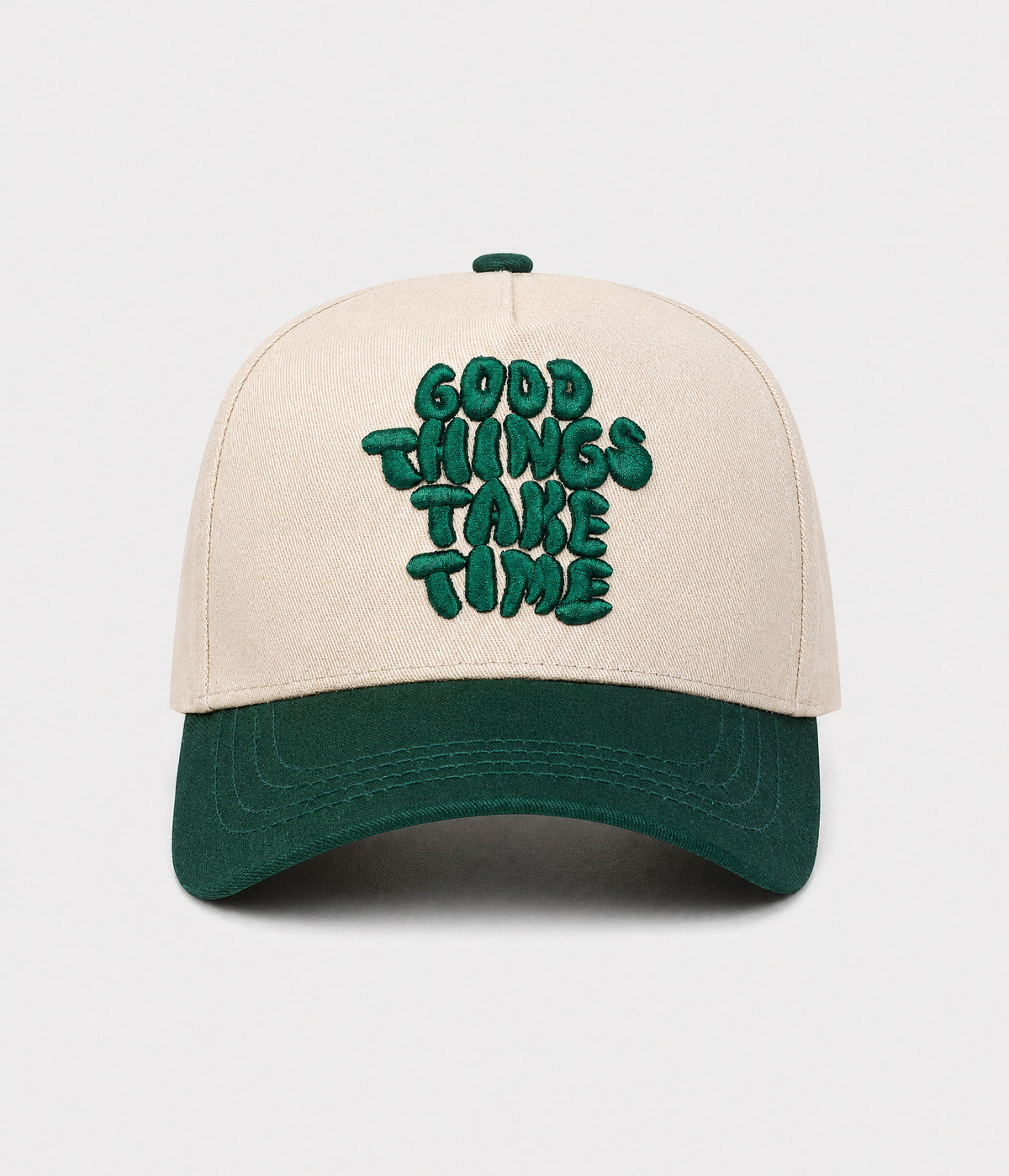 GOOD THINGS TAKE TIME SNAPBACK. cream cotton snapback with GREEN visor, front view