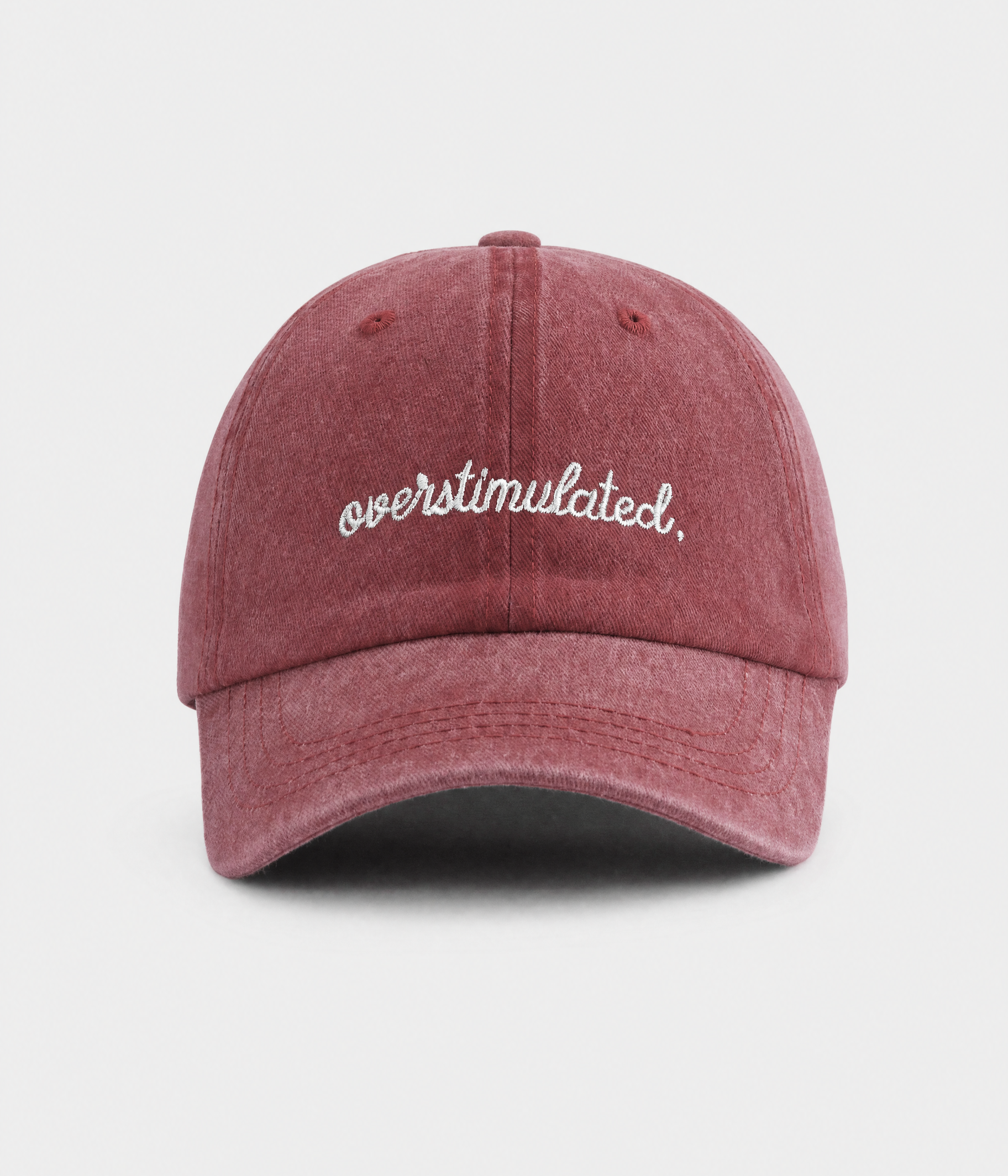 OVERSTIMULATED. washed cotton dad cap in red, front view