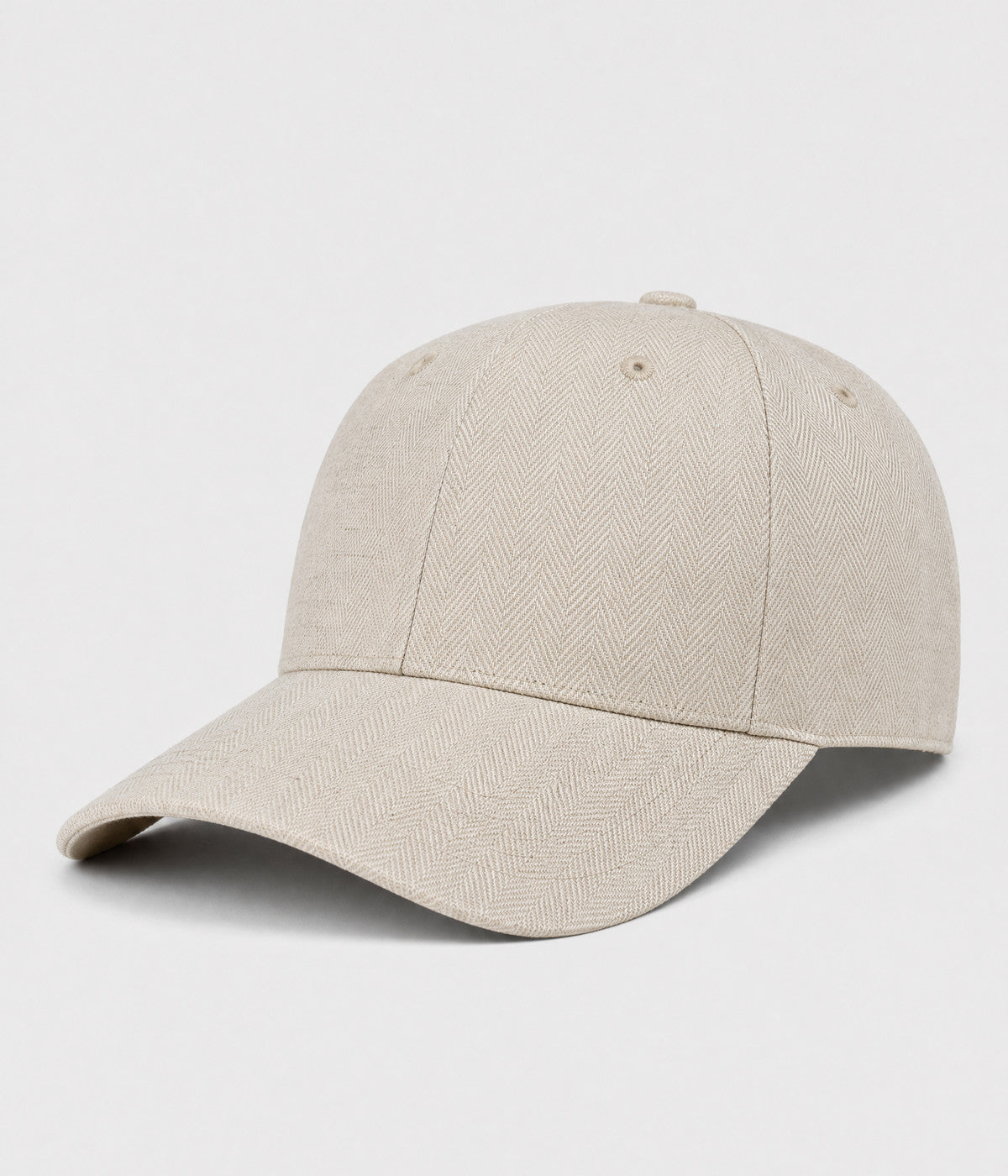 HERRINGBONE LINEN CAP. herringbone linen cap in beige, side view