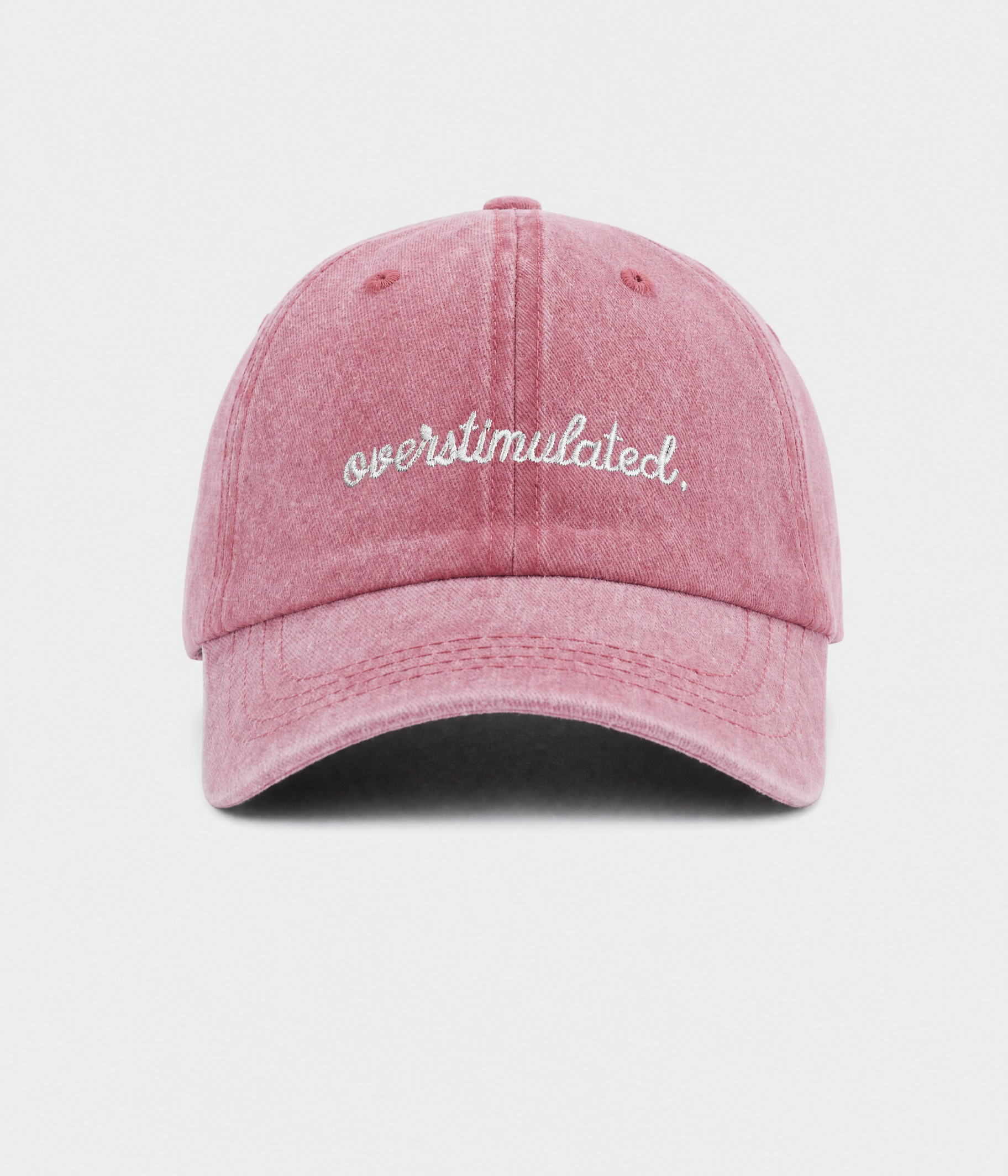 OVERSTIMULATED. washed cotton dad cap in pink, front view
