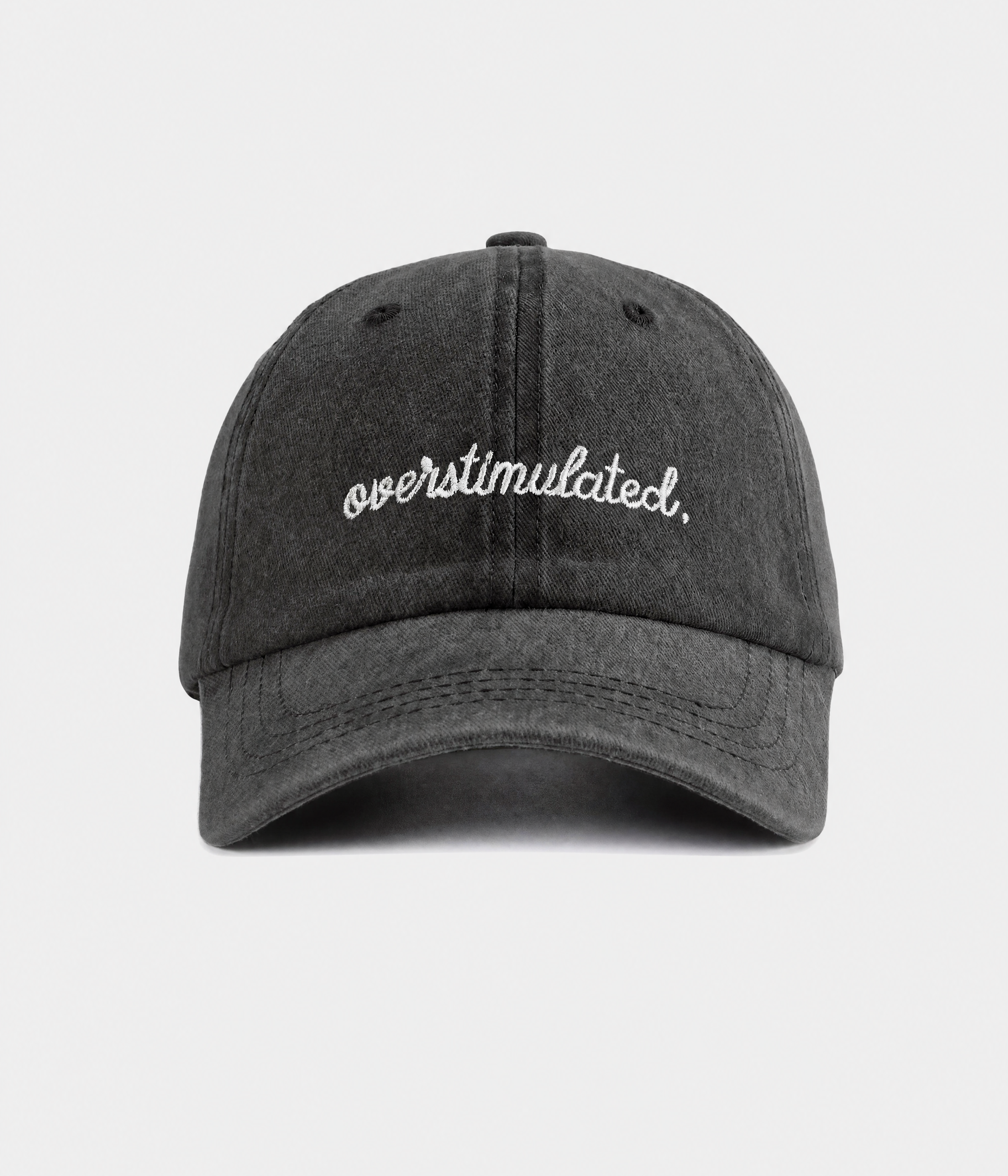 OVERSTIMULATED. washed cotton dad cap in black, front view