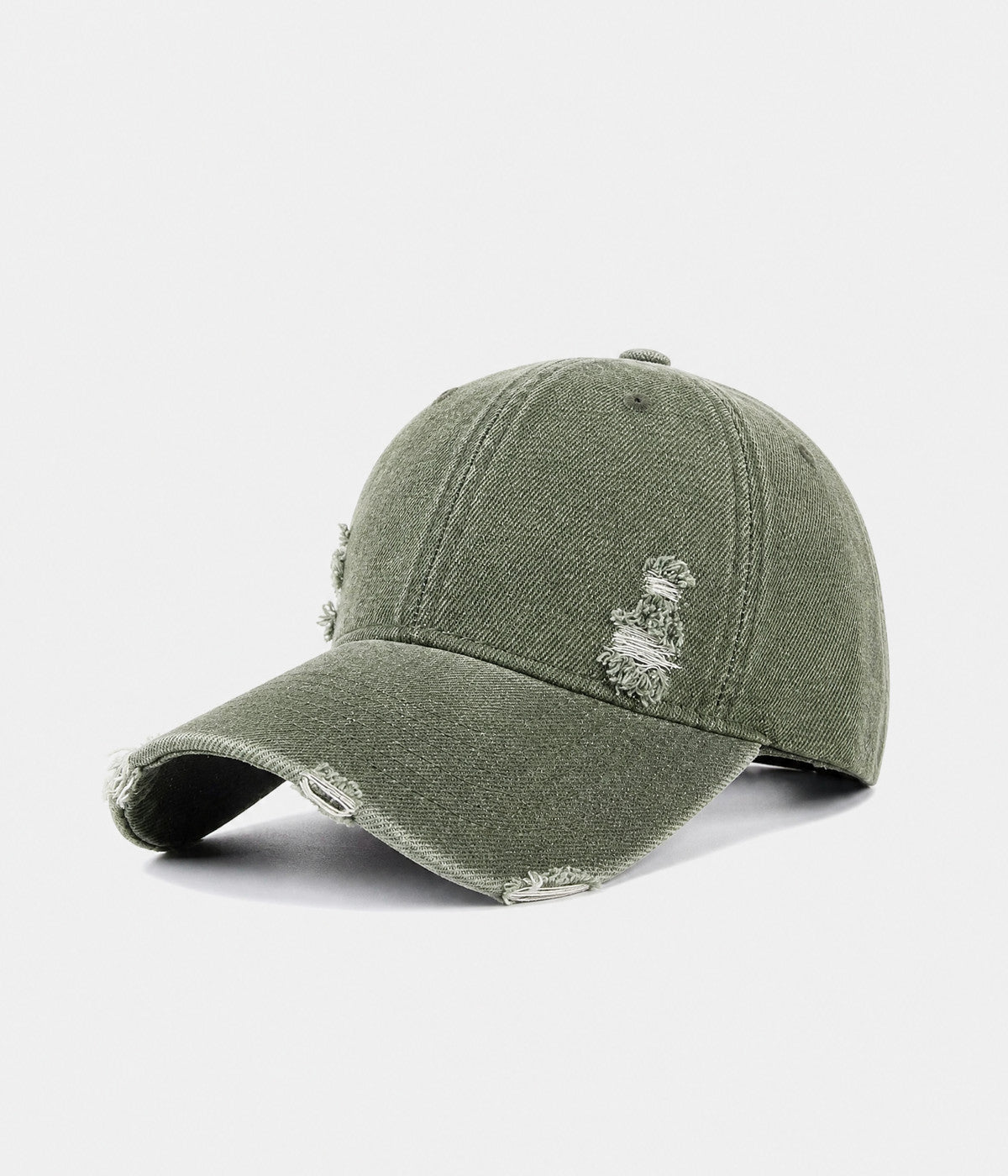 RIPPED DENIM. washed cotton denim cap in dark green, side view