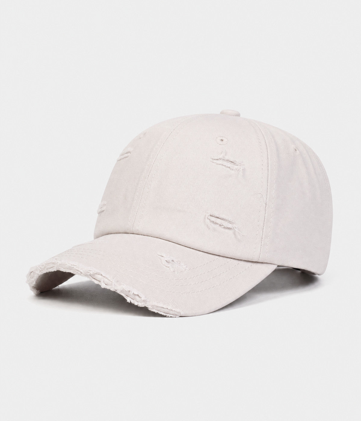 RIPPED COTTON. distressed cotton cap in beige, side view