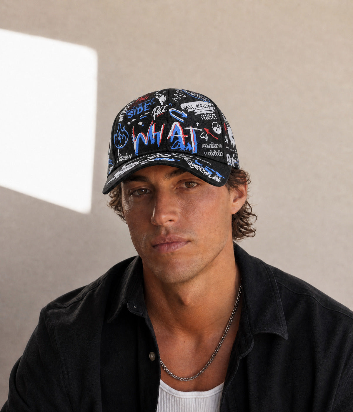 GRAFFITI CAP. — BLACK/BLUE worn