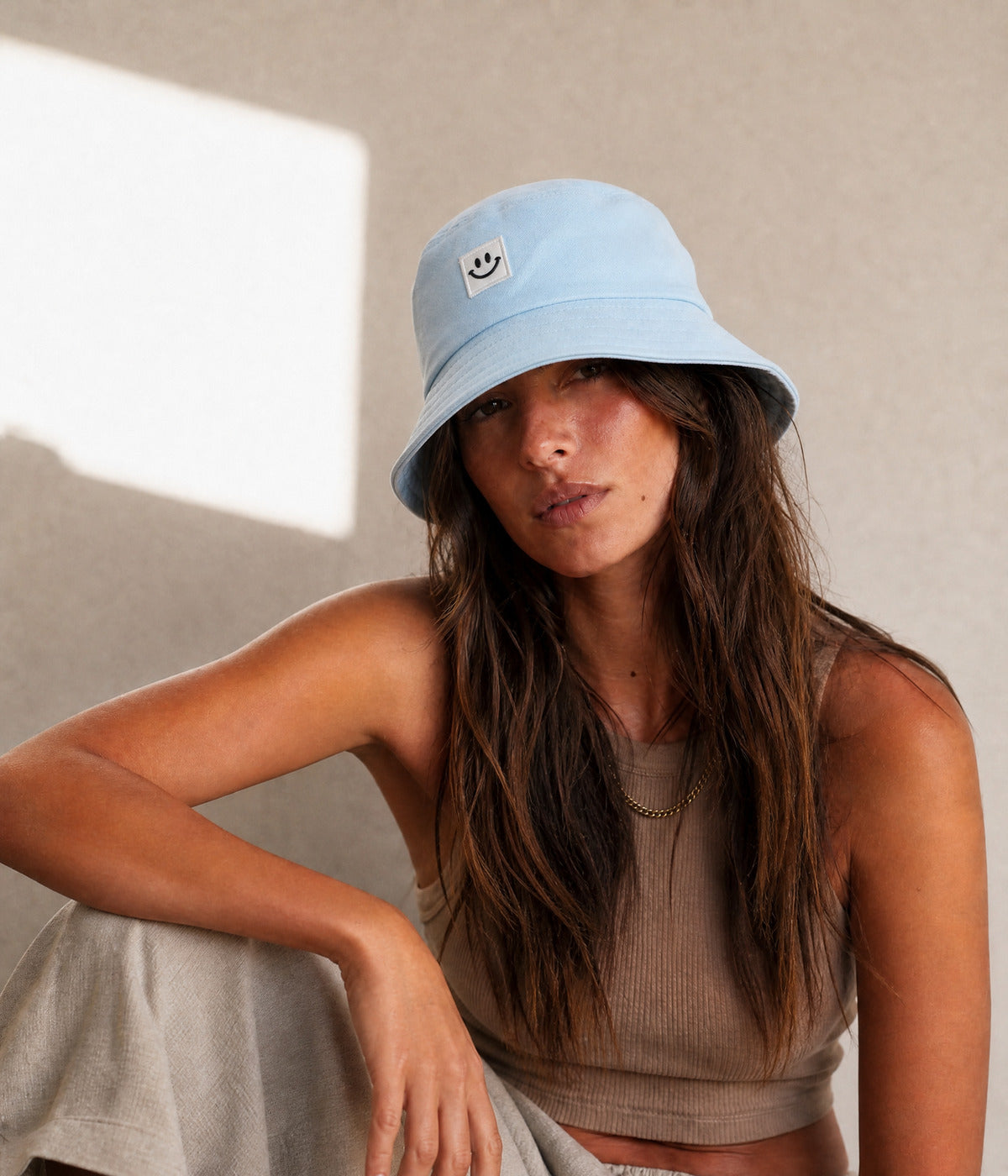 HAPPY BUCKET. BLUE worn by a woman
