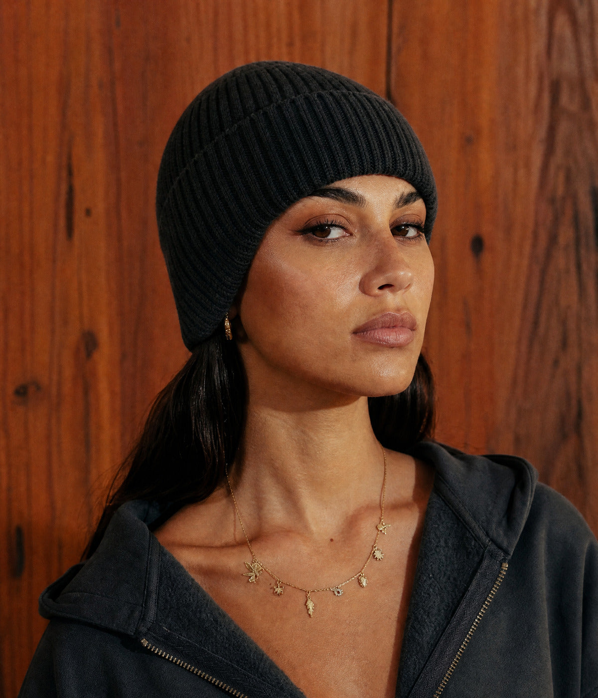 KNIT EARMUFF BEANIE. — BLACK worn