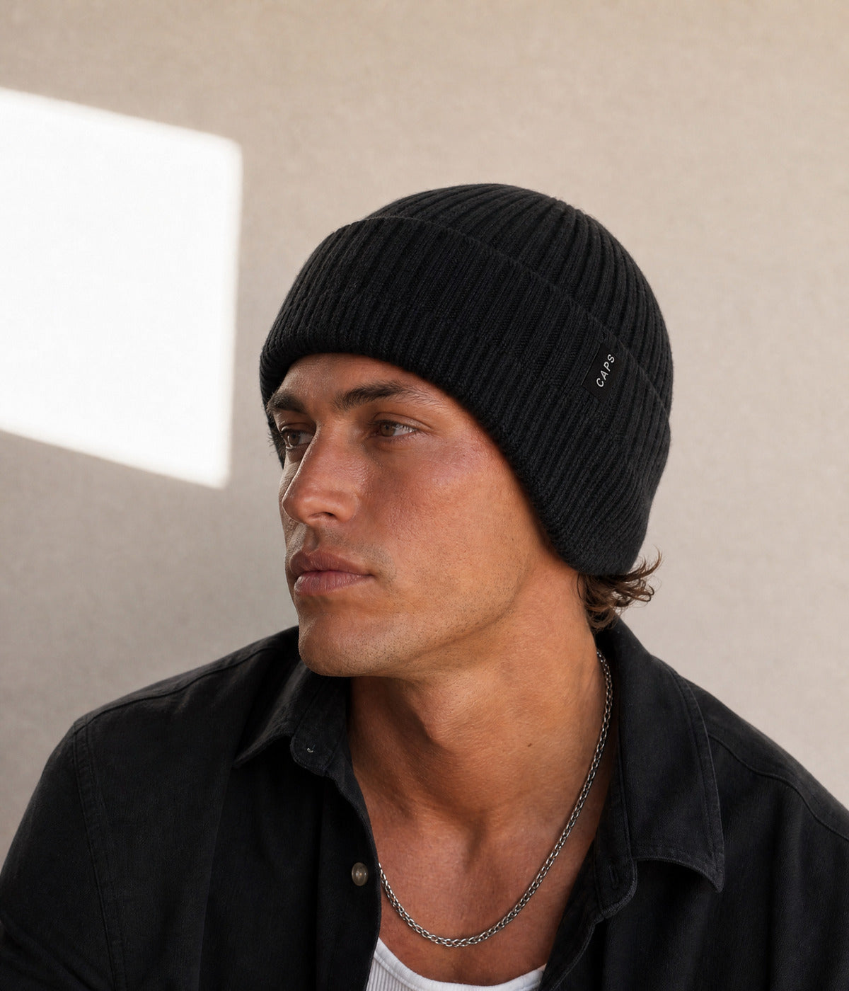LOGO CABLE EARMUFF BEANIE. — BLACK worn