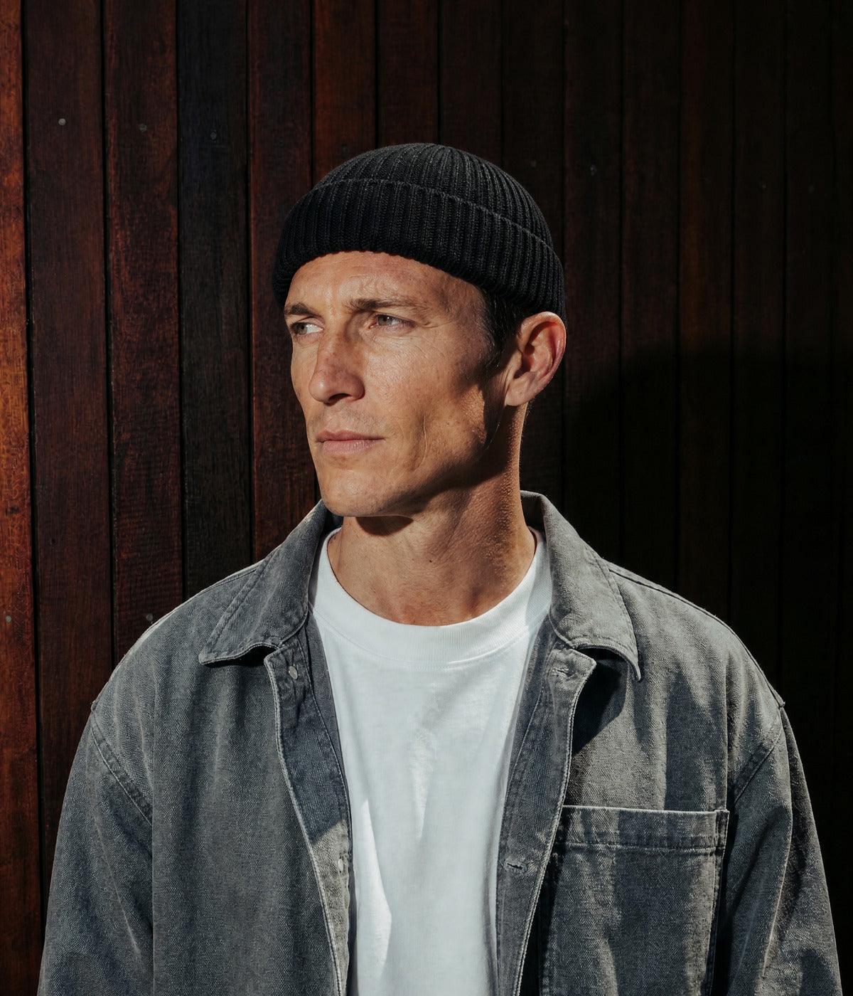LOGO FISHERMAN BEANIE. — BLACK worn