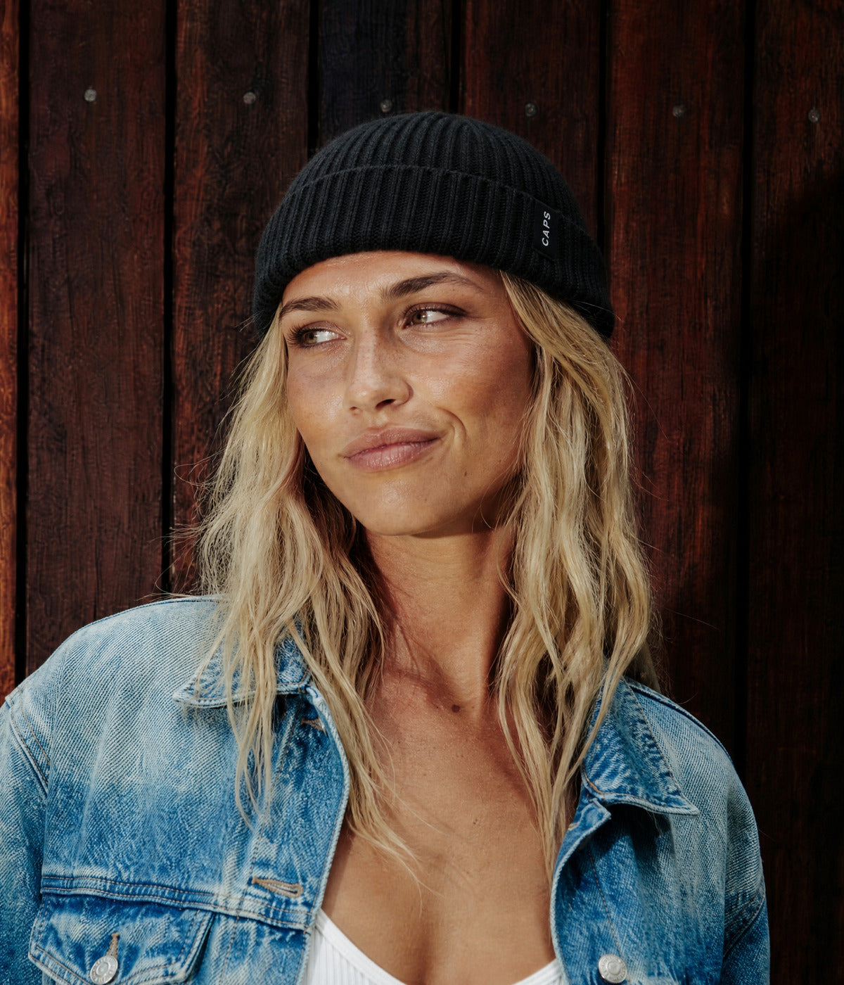LOGO FISHERMAN BEANIE. — BLACK worn
