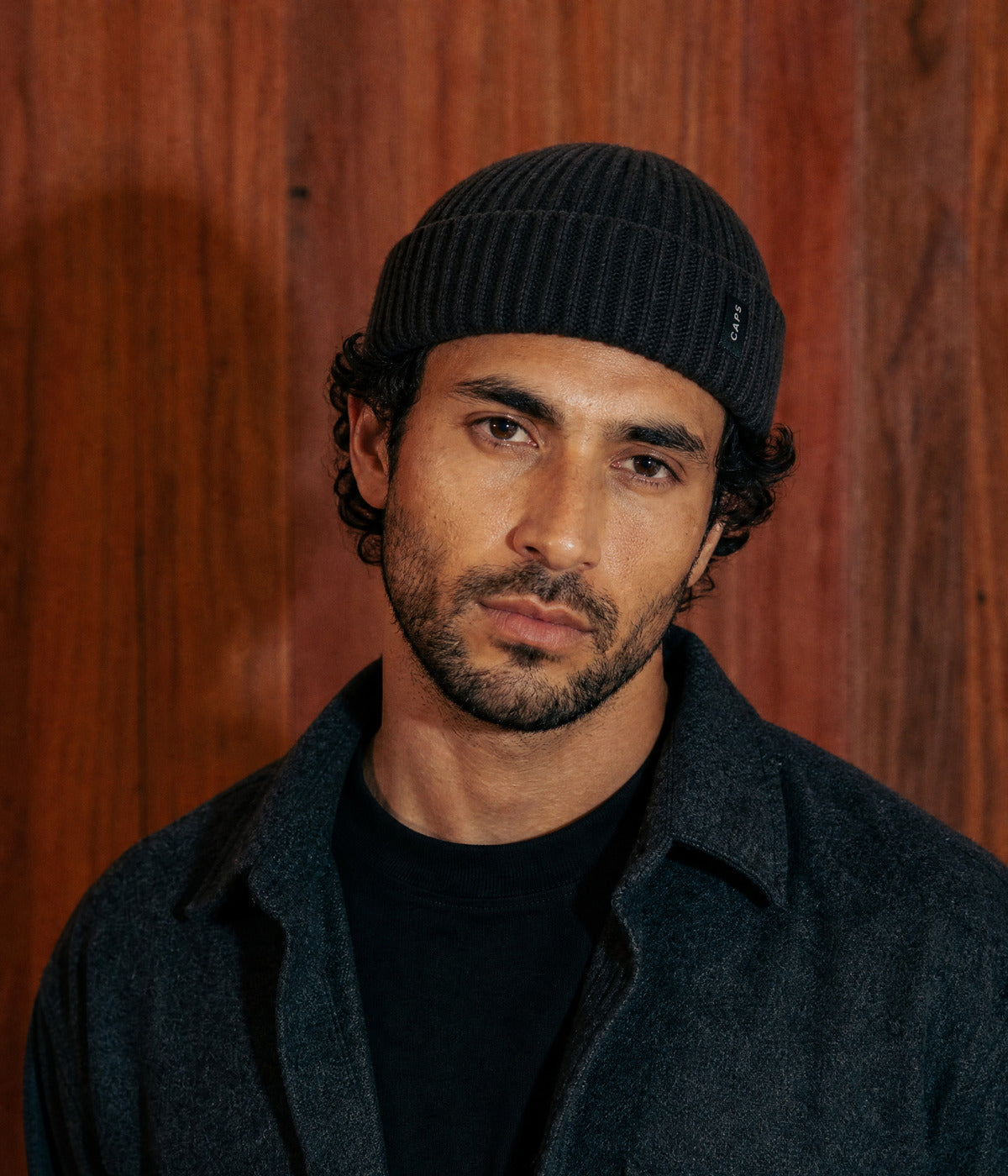 LOGO FISHERMAN BEANIE - 100% MERINO. — BLACK worn