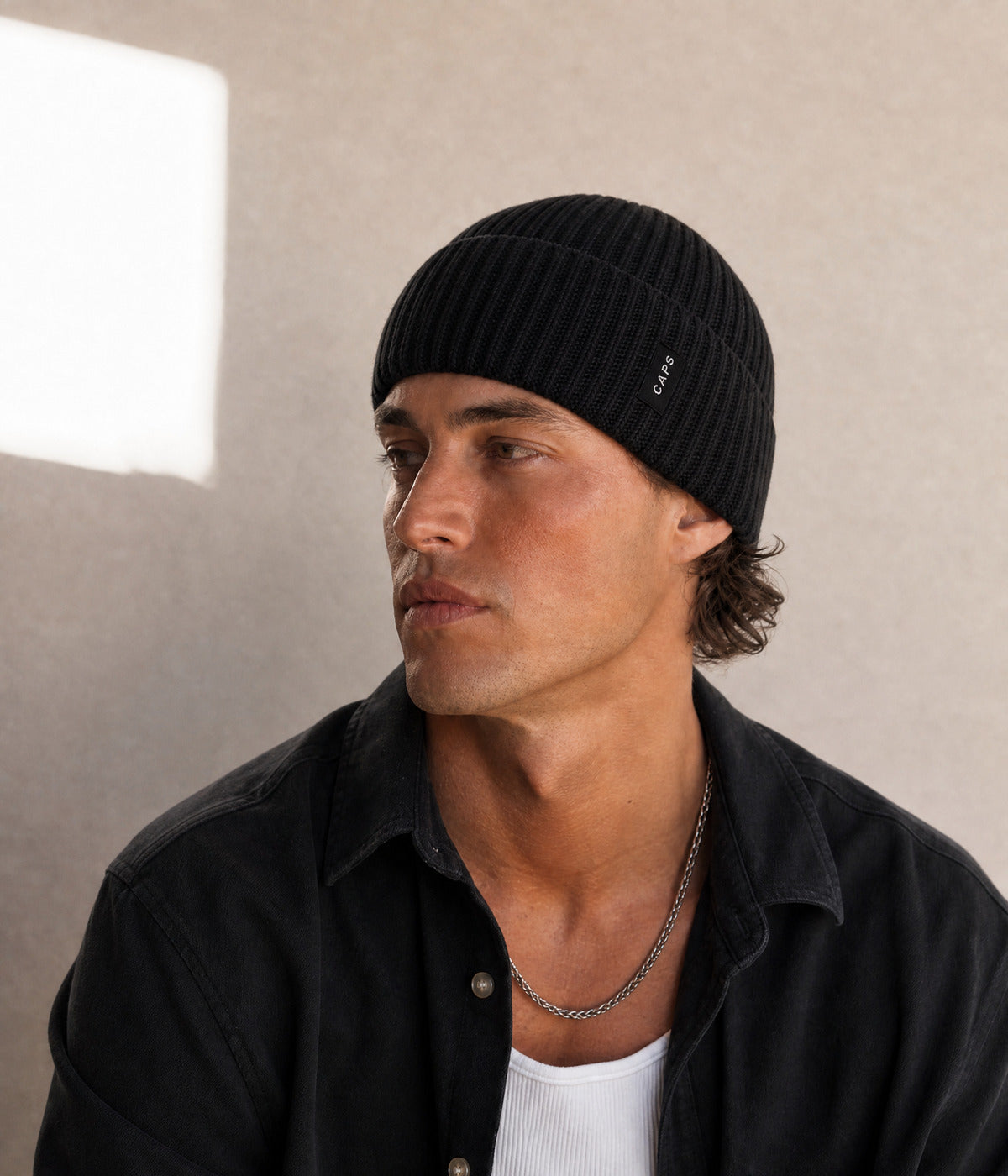 LOGO MID FIT BEANIE. — BLACK worn