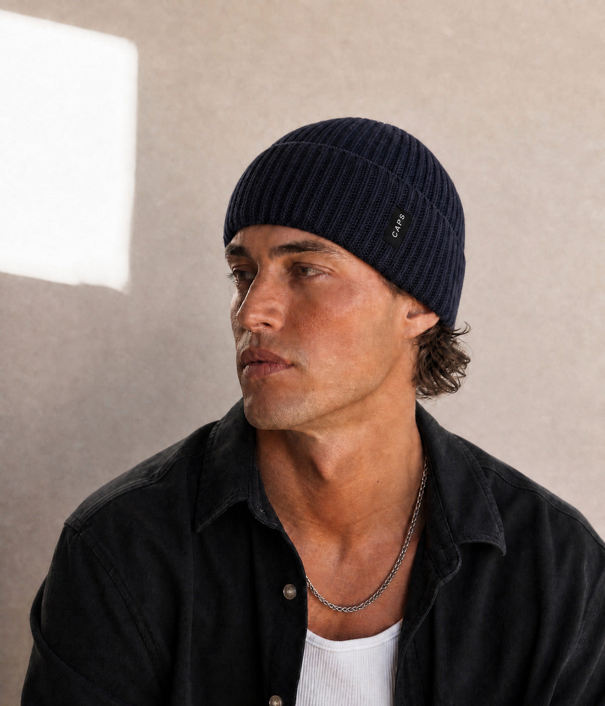 LOGO MID FIT BEANIE. — NAVY worn