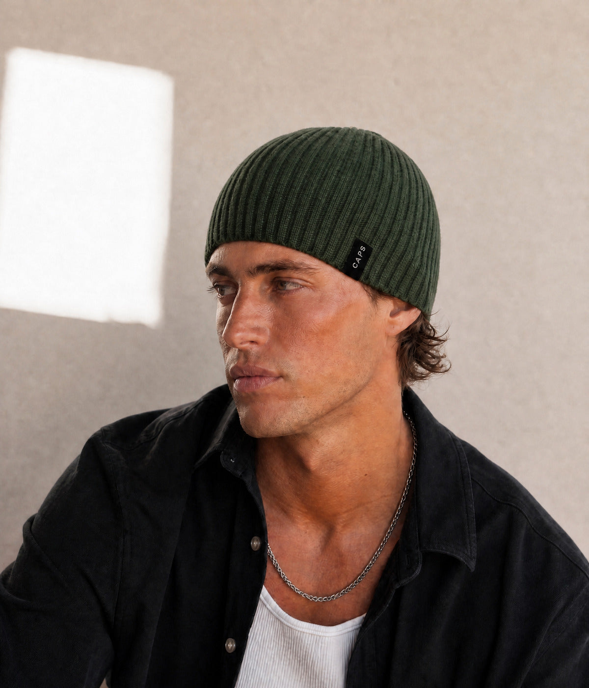 LOGO RIB KNIT BEANIE. — ARMY GREEN worn