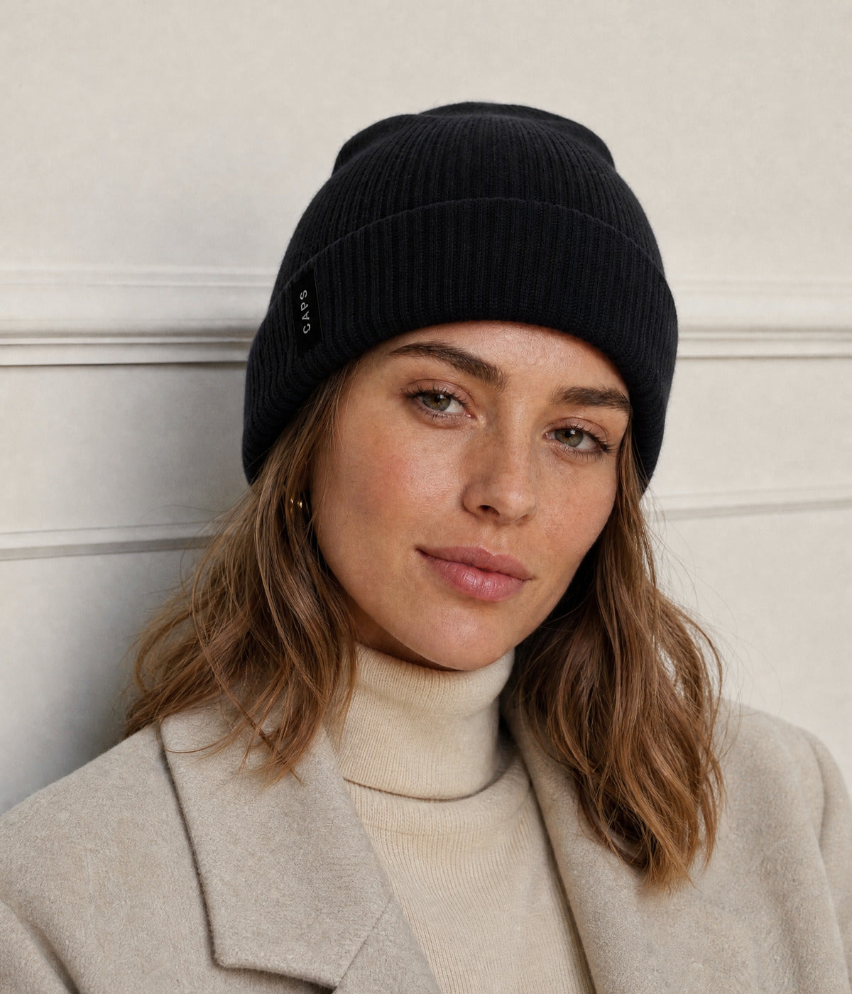 LOGO RIBBED BEANIE. — BLACK worn
